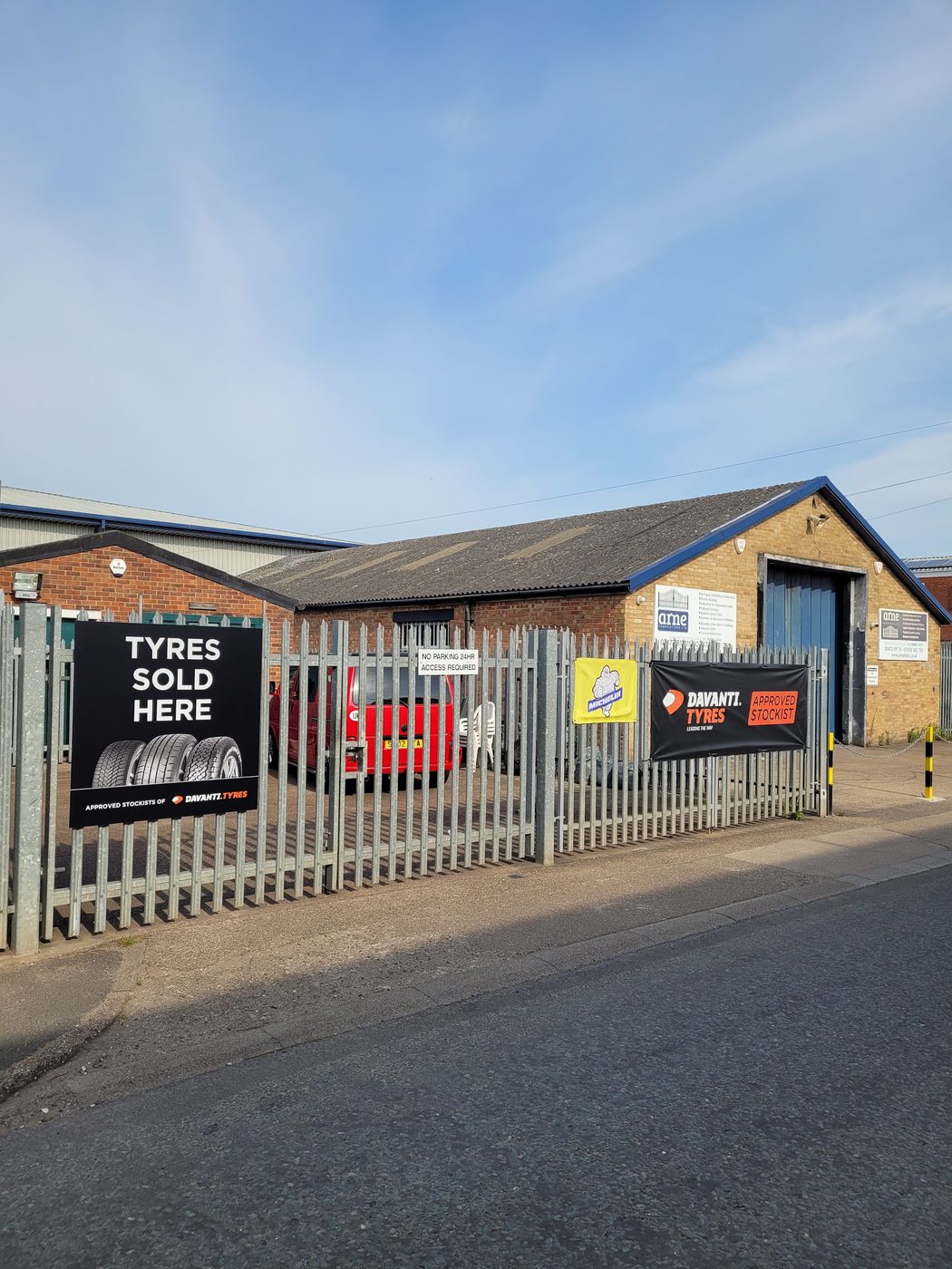 The Neptune Tyres yard gate on Wilton Road, with a Tyres Sold Here sign and a Davanti approved stockist banner